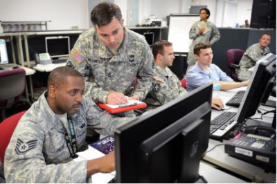 Air Force Staff and civilian personnel concentrate on exercise scenarios during “Cyber Guard 2015” in Suffolk VA. (DoD photo by Marvin Lynchard.)