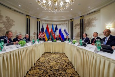 U.S. Secretary of State John Kerry sits next to Assistant Secretary of State for European and Eurasian Affairs Toria Nuland on May 16, 2016, at the Bristol Hotel in Vienna, Austria, as U.S., Russian, and French officials met with Armenian and Azarbaijani leaders in an effort to calm tensions over the disputed Nagorno-Karabakh region.